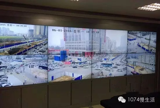 通過監(jiān)控人員操控“電子眼”調整焦距，可以看到整個工地全景